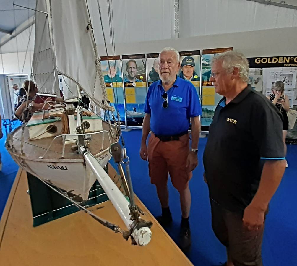 Sir Robin Knox-Johnston admiring a model of Suhaili