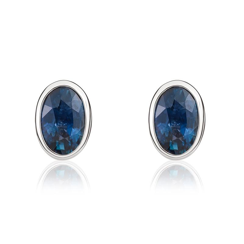 9ct White Gold Sapphire 6x4mm Oval Rub Over Set Stud Earrings