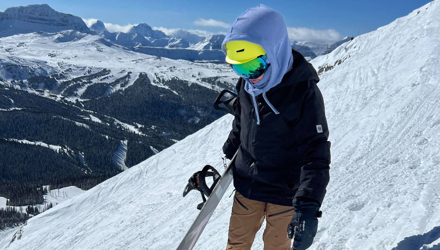 Jayde Syrnyk Walking with Snowboard At The Top of Goats Eye Chair at Sunshine Valley Ski Resort Banff Alberta