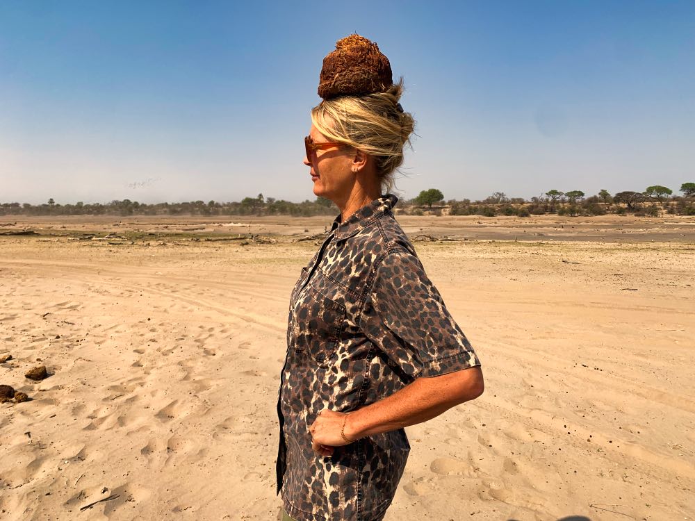 Model Wearing Elephant Poo Hat