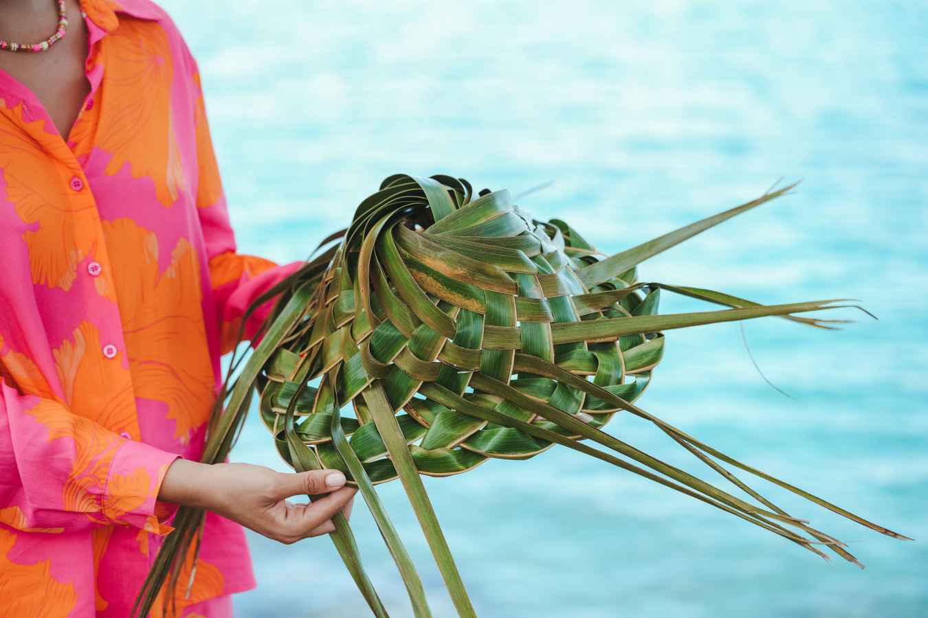 Making a hat from palm leaves