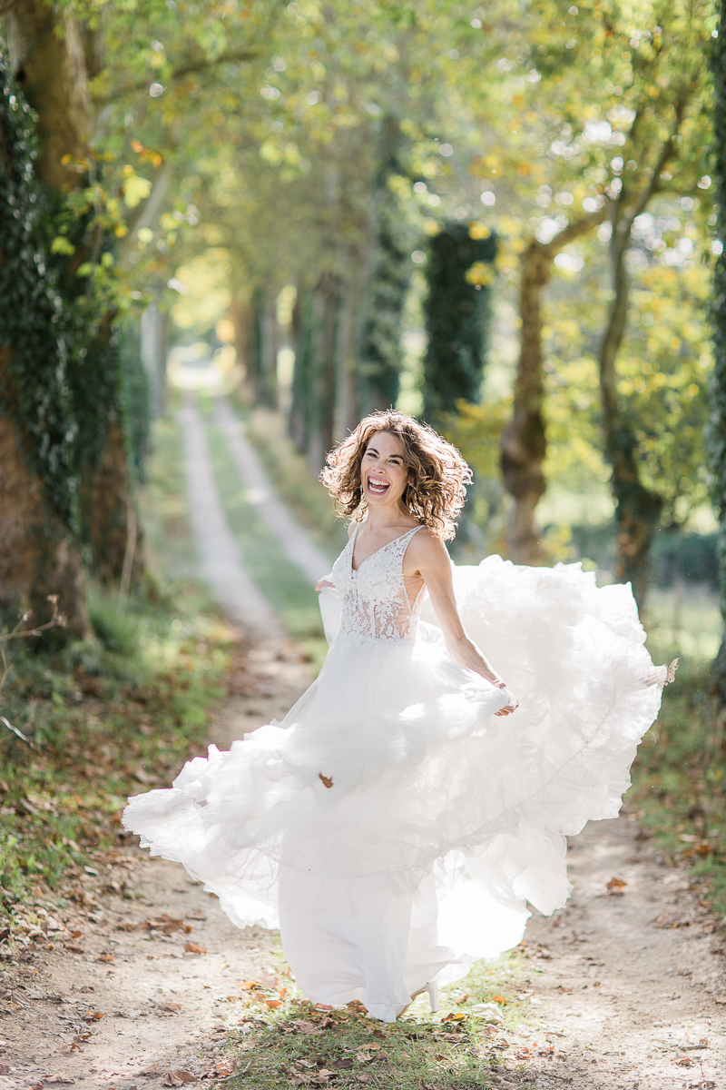 Twirling in my wedding dress on Lerse's long drive 