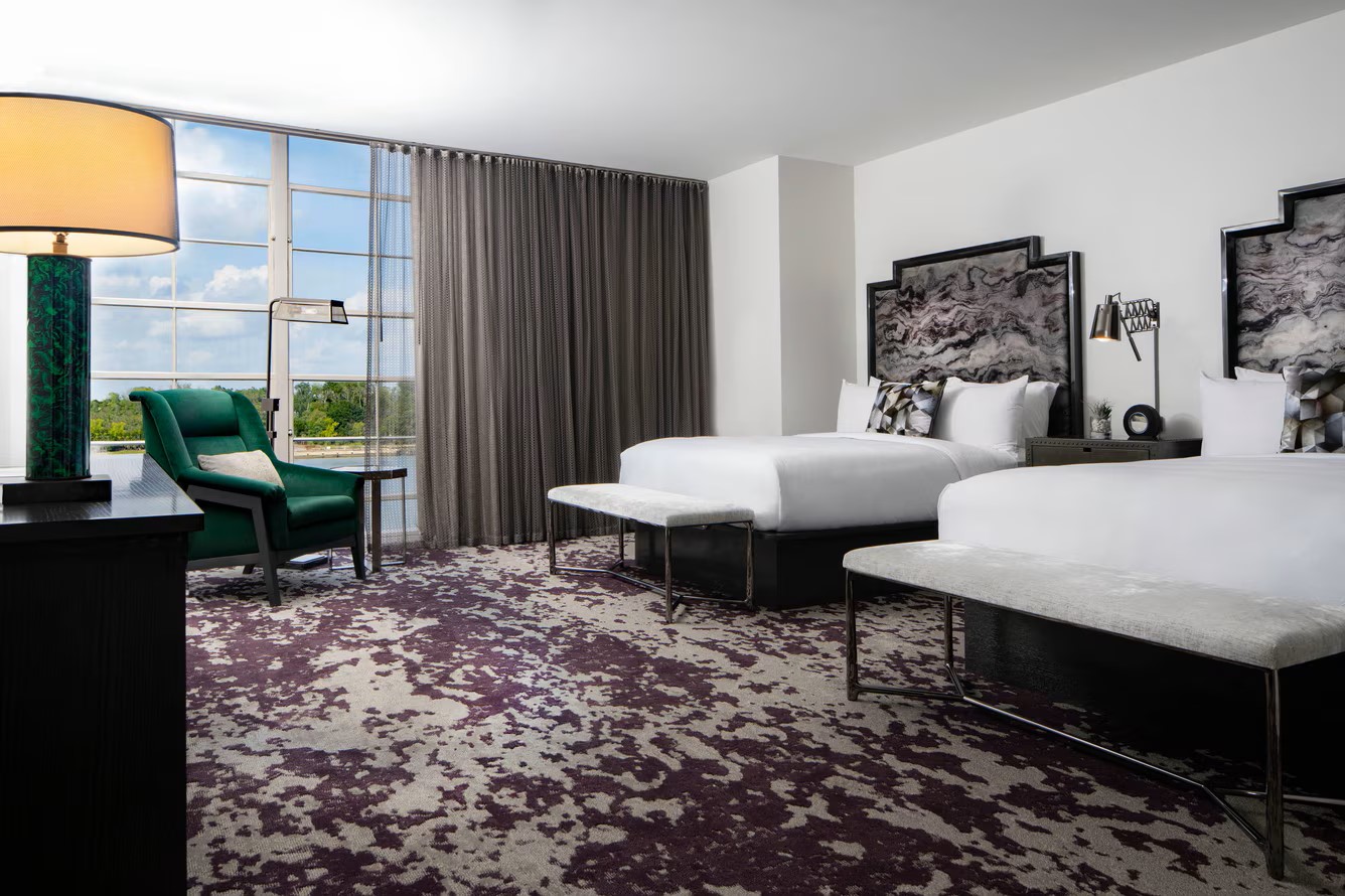 Power Plant queen river-view guestroom