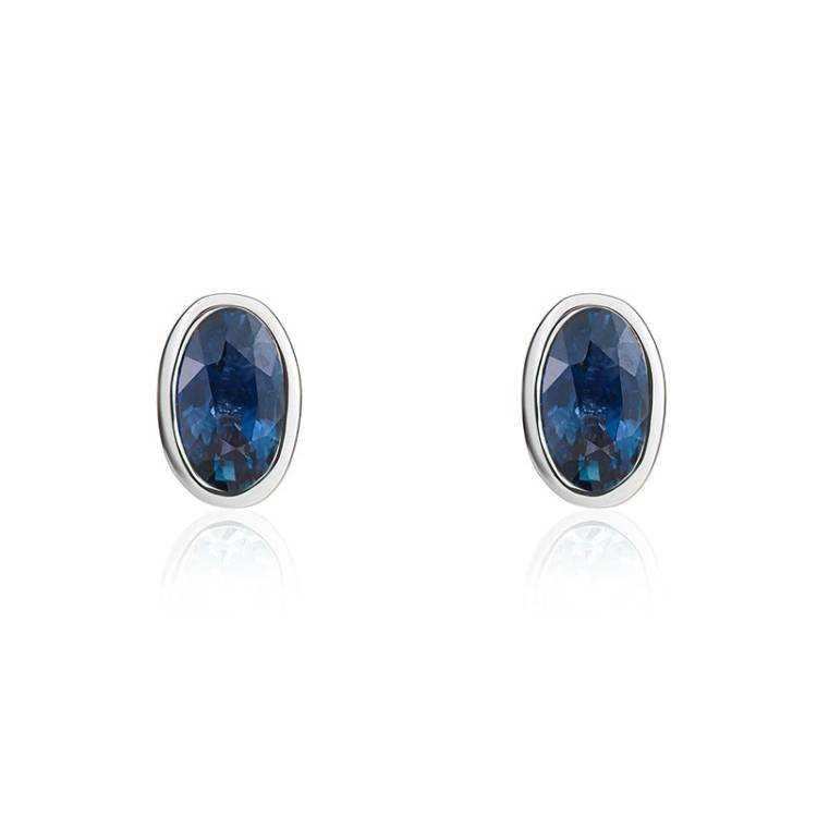 9ct White Gold Sapphire 5x3mm Oval Rub Over Set Stud Earrings