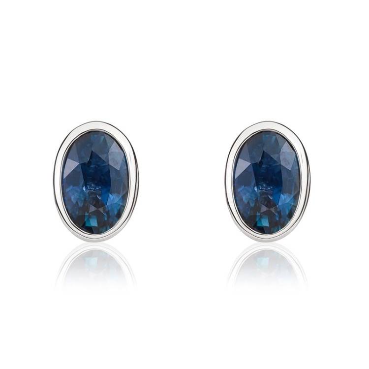 9ct White Gold Sapphire 6x4mm Oval Rub Over Set Stud Earrings